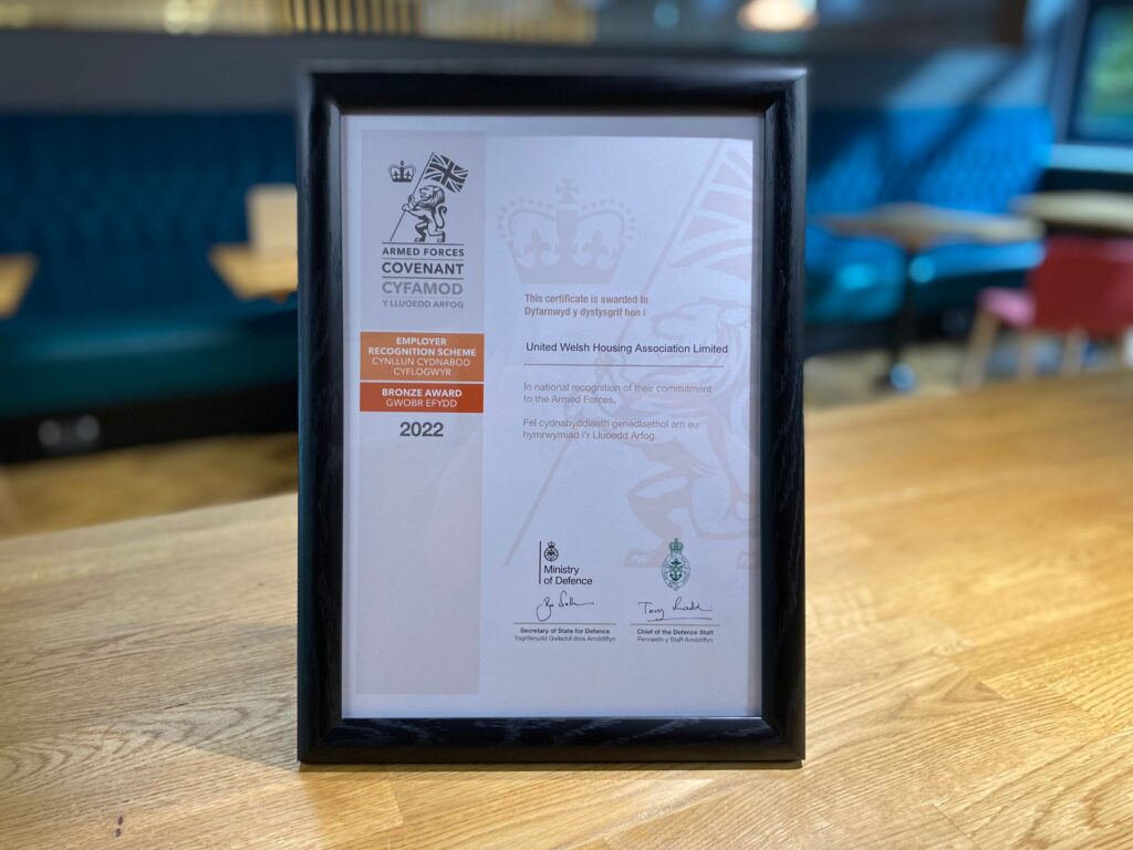 A framed certificate on a table.
