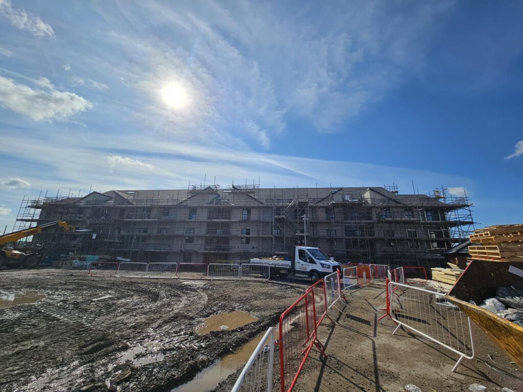 An external image of a new development in Barry Waterfront. It is a large, wide building.