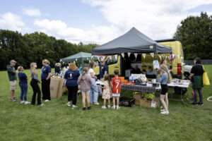 United Welsh Summer Roadshow gazebo in a green field.