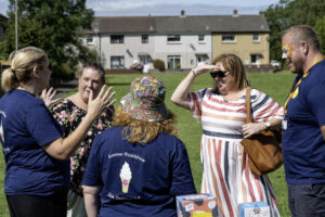 Group of UW staff talking to residents