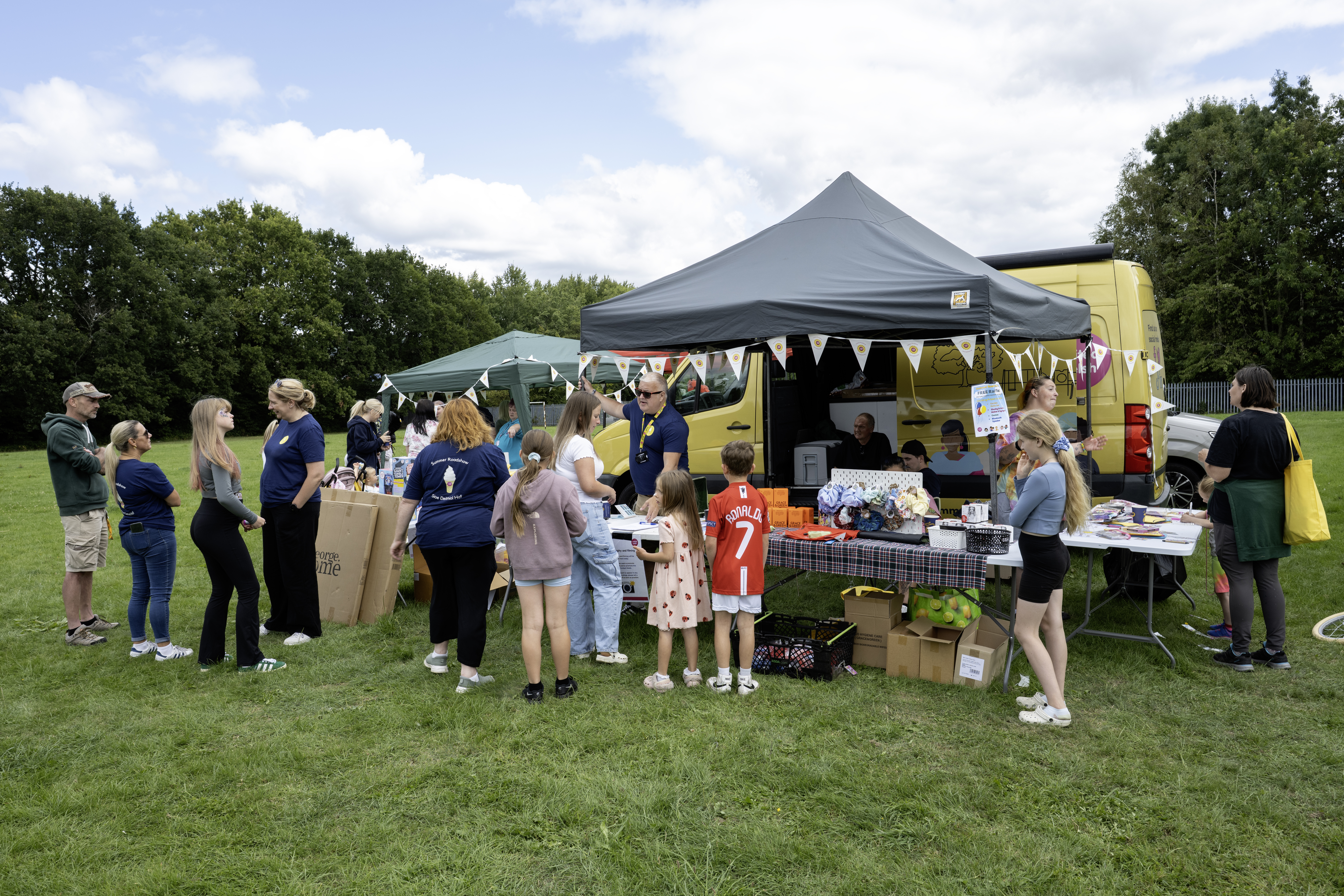 United Welsh Summer Roadshow gazebo in a green field.