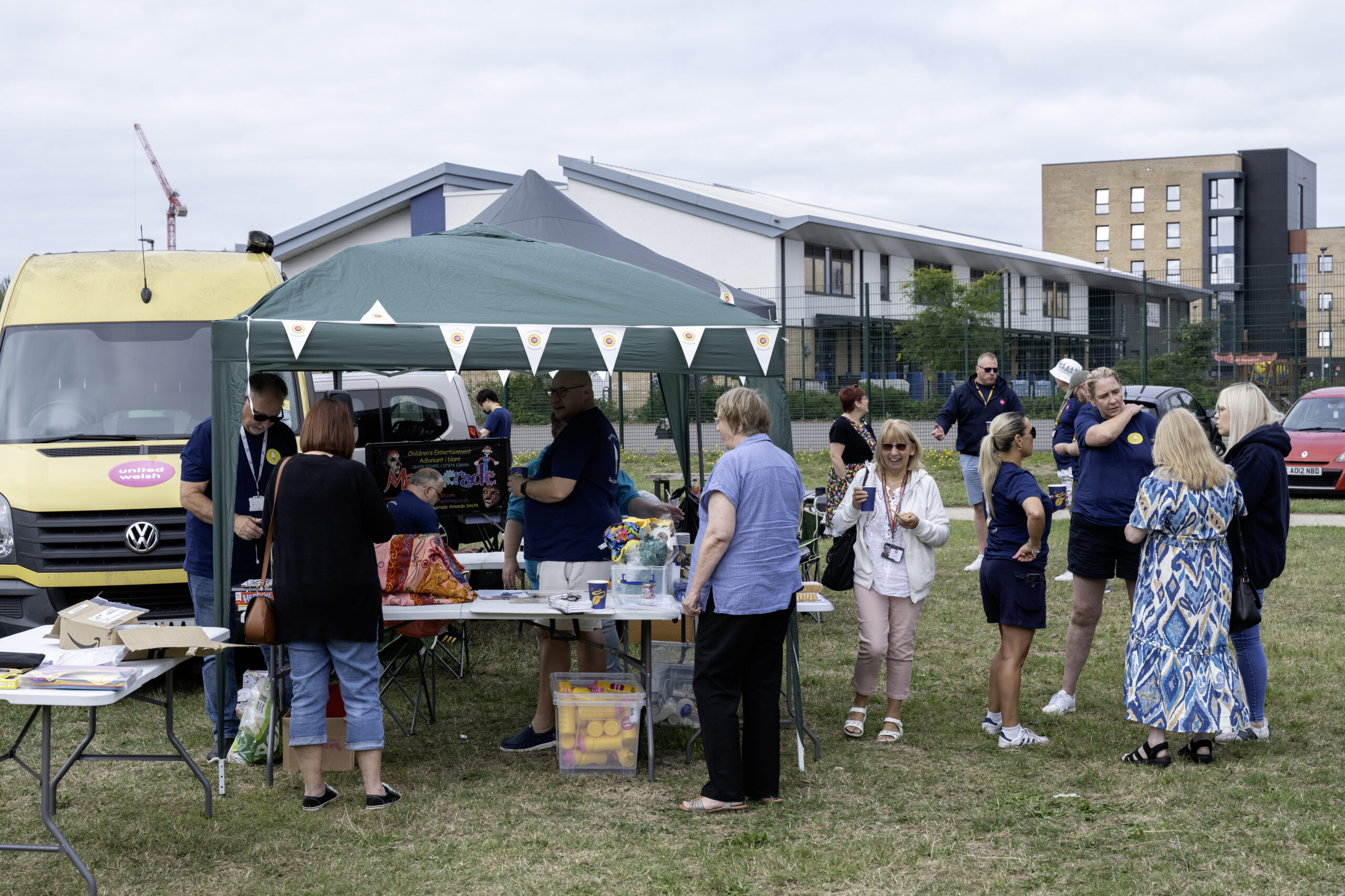Photo of staff and residents at gazebo in our Summer Roadshow 2025 in Cardiff.